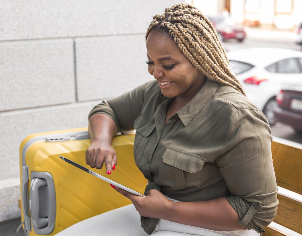 smiley-woman-looking-her-tablet